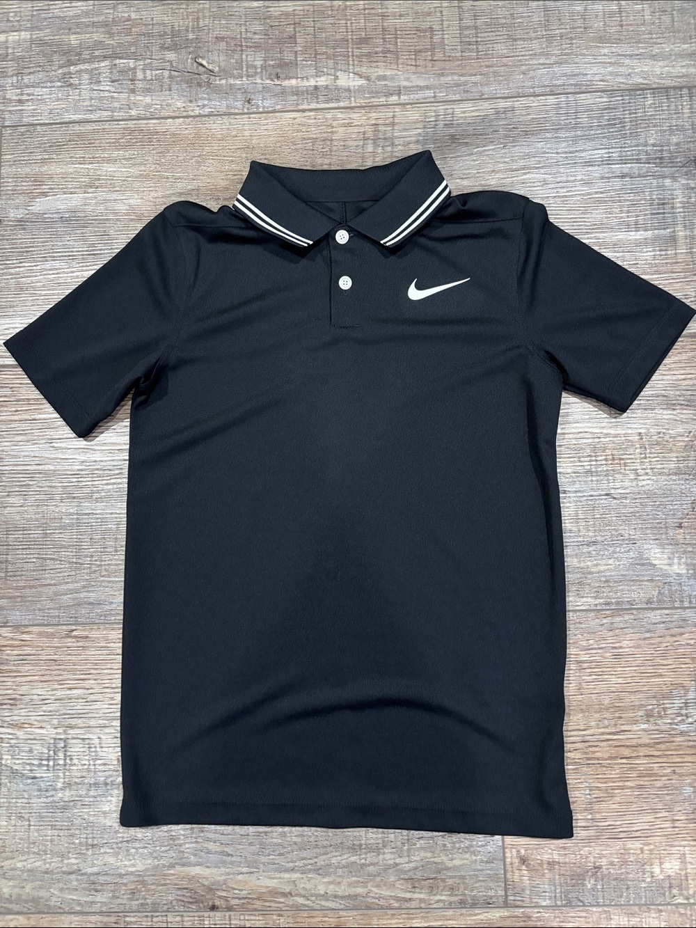 Boys Nike golf polo shirt, black/white. Small